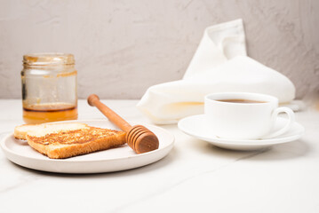 Croutons for breakfast with honey and coffee.