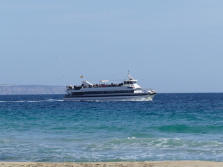 Fototapeta premium Excursion boat off Cala Mayor, Mallorca, Balearic Islands, Spain