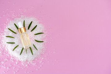 cosmetic oil with salt and rosemary leaves, spa, flat view, self care concept 