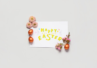 Beautiful Easter composition with greeting card on color background