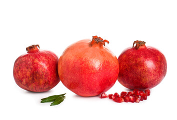 Tasty ripe pomegranates on white background