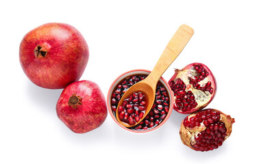 Bowl of pomegranate molasses and fresh fruits on white background