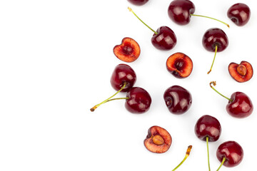 Red fresh cherry and cherry slices isolated on white background.
