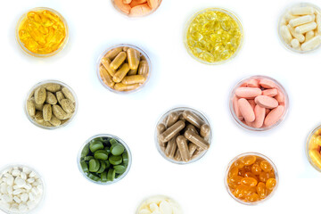 Supplements and vitamins on a white background. Selective focus.