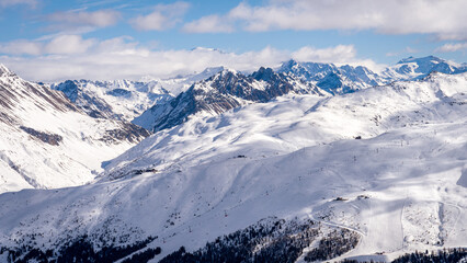 Fototapeta na wymiar Scenic view of Livigno ski resoret in Sondrio province, Italy. Popular skiing resort in European Alps. Snowcapped mountain range