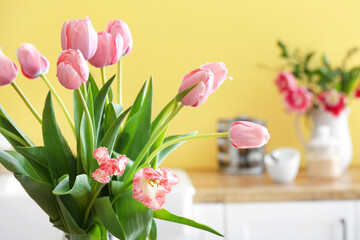 Bouquet of tulips in kitchen, closeup