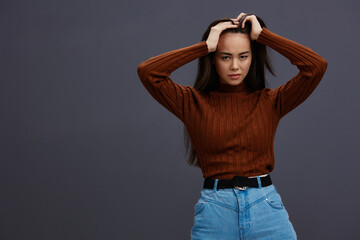 Brunette hand gestures brown sweater fashion emotions isolated background