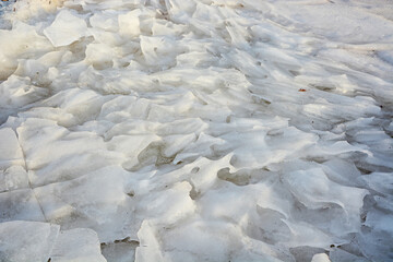 Background from broken pieces of ice. Texture, pattern, closeup