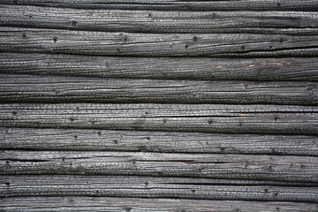 Background from burnt old wooden boards (wooden beam). Vintage texture, background.