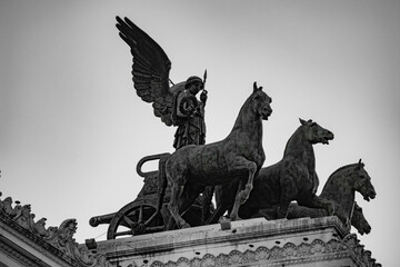 Fototapeta premium Sculptures and buildings in Rome, Italy