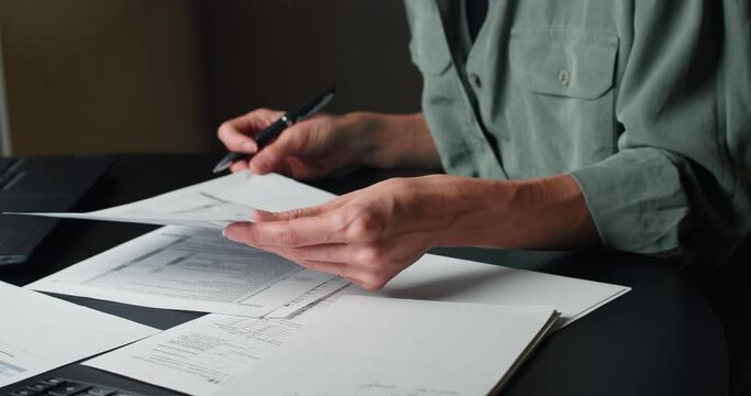 Taxation in USA and Tax Form 1040 - businesswoman filling out the document