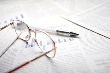 eyeglasses on the newspaper pages