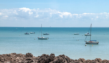 Yachts and boats in the sea in Cancale, oyster capital of Brittany, France.
