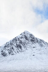 Fototapeta na wymiar Buachaille Etive Mor covered in snow during winter aerial view