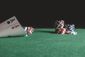 Poker cards, chips, dice on the game table. Casino concept