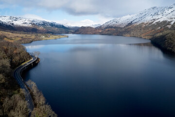 Naklejka premium Loch Lomond aerial view showing the A82 road during autumn