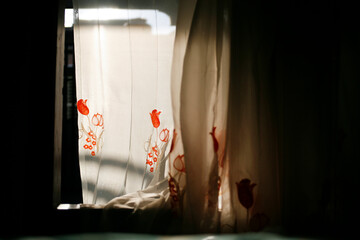 Light sheer curtains with a floral pattern