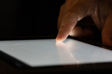 Finger touch on Tablet screen Mock up with light. Concept for mobile phone technology and technology.