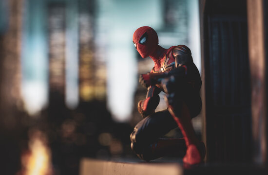 NEW YORK USA, FEB 24 2022: scene with Marvel comic hero Spiderman on a ledge overlooking New York City - Hasbro action figure