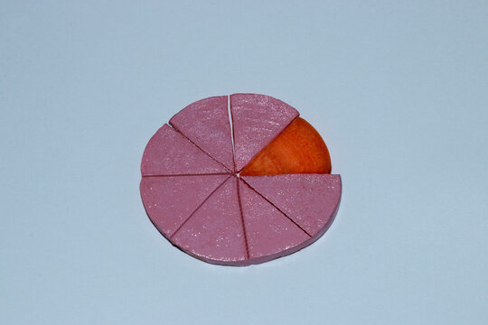 A Circle Of Pink Carrots Cut Into Eight Pieces One Piece Is An Orange Creative Vegetable Cake Concept