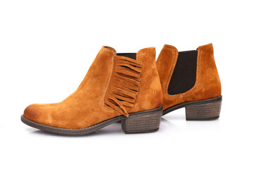 Female brown leather boots on white background, isolated product.