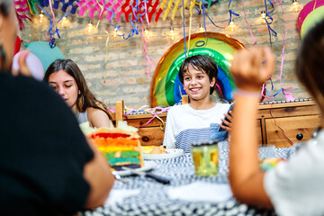 Happy birthday boy celebrating birthday with family