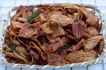 Banana slice chips in bamboo basket