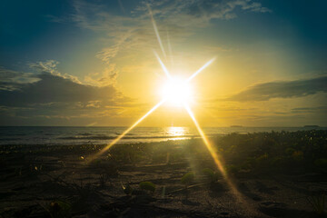 Beach sunset landscape with bright sunlight