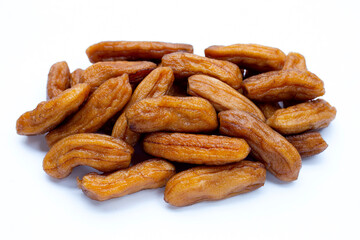 Sun-dried bananas on white background.