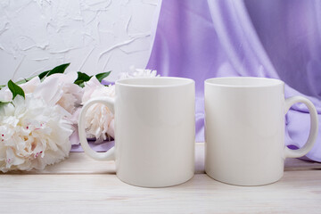 Two white coffee mug mockup with pink peony and lilac scarf