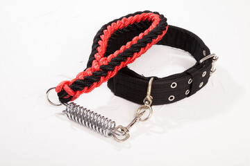 Black and red dog collar on white background