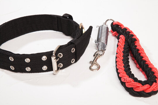 Black And Red Dog Collar On White Background