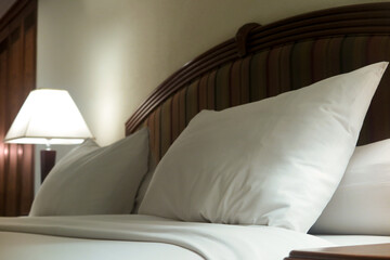 pillow with white pillowcase on the bed