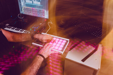light painting image of man working in home music studio