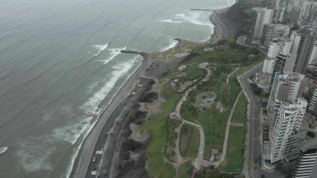 Saturated overcast flight over coastal Ninos Park in Miraflores, Peru