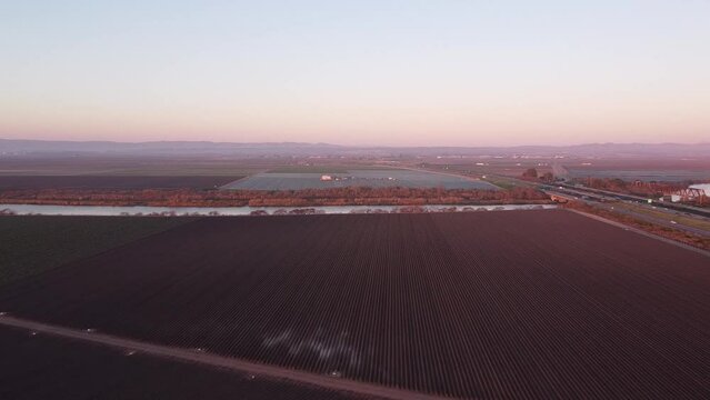 Massive farm fields near Castroville and Salinas river, California, USA. Aerial drone view