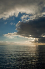 Sun is behind the clouds off the coast of California
