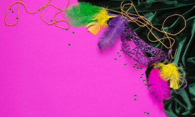Carnival mask colored feathers traditional sequin beads for Mardi Gras festival purple background