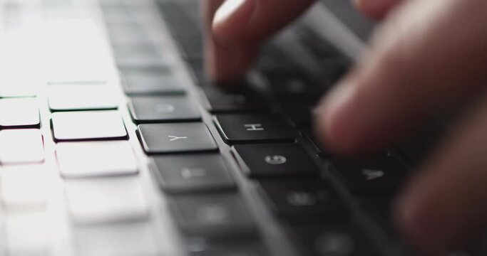 4K Video close up hand typing on keyboard notebook. Concept for coding and technology.