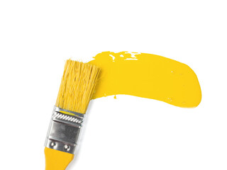 A yellow brush performing a smear with yellow paint isolated on a white background. Trending colors.