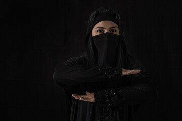 Muslim female wearing hijab or nigab showing the equal symbol for International Women's Day
