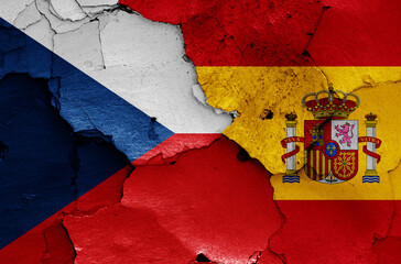 flags of Czech Republic and Spain painted on cracked wall
