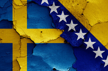 flags of Sweden and Bosnia and Herzegovina painted on cracked wall