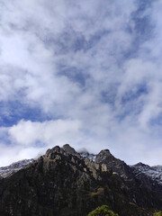 Naklejka na ściany i meble Amazing view of snowy rocky mountains on sunny day