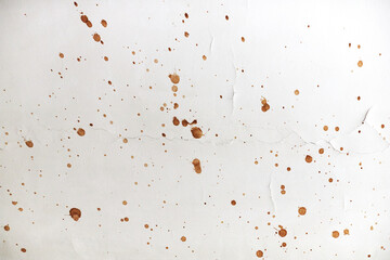 The texture of the ceiling with splashes of brown paint. Front view. 