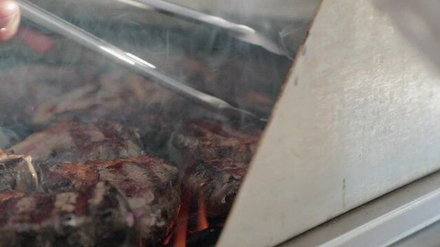 Lamb chops cooking on barbecure. Slow Motion