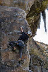 Rock Climber climbing the route La Presuda in Suesca Colombia