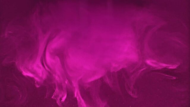 Paint fall into water which is twist. Spin acrylic ink drip into liquid. Visual effect bullet time, frozen moment, flow motion. Cloud fraction of color is spray drop. Slow motion cosmic video magic.