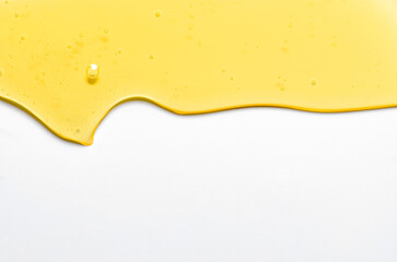Fresh honey or synthetic oil or vegetable oil. White background. Copy space.