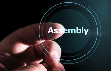 Hand pressing Assembly button on virtual screens.  Assembly Programming Language
